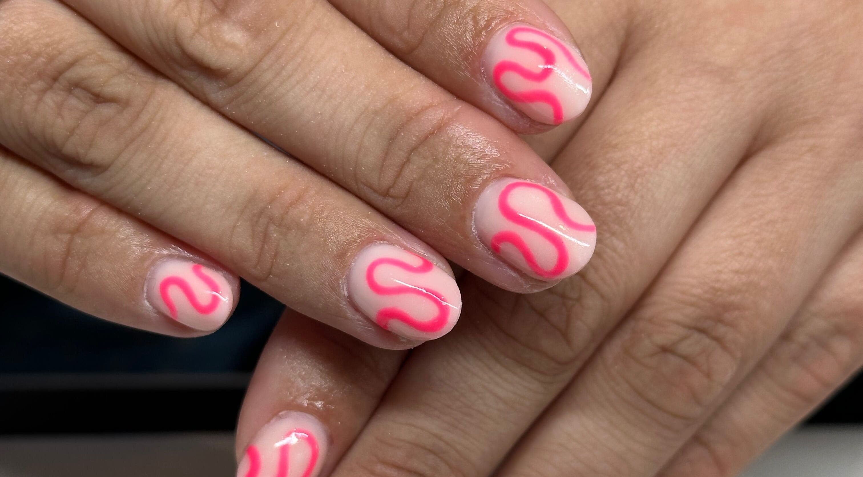 Stylish pink and white nail art from I Hart Beauty in Kirkham, England, GB enhancing hand beauty.