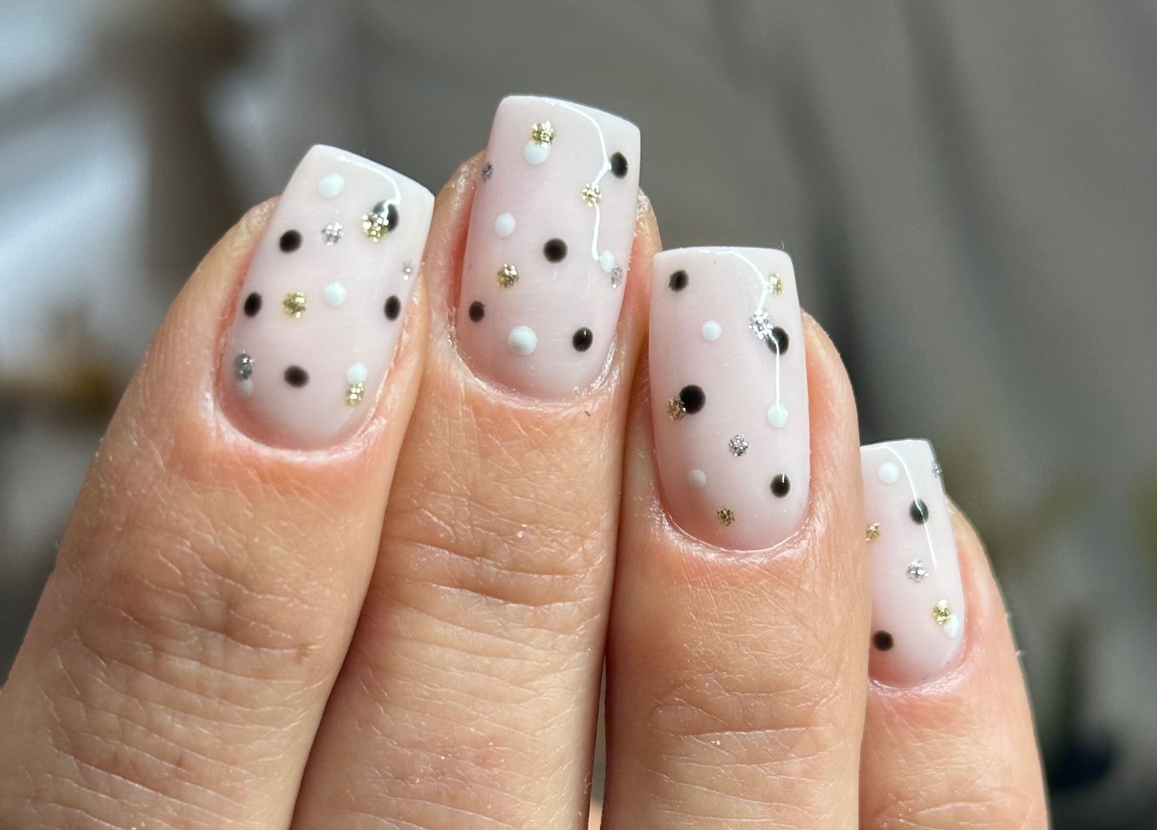 Stylish polka dot nail art at I Hart Beauty in Kirkham, England, GB.