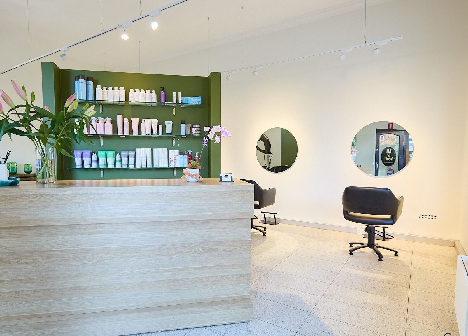 Stylish salon interior at Lit & Scott, Stanmore, New South Wales, AU, featuring modern decor and beauty products.