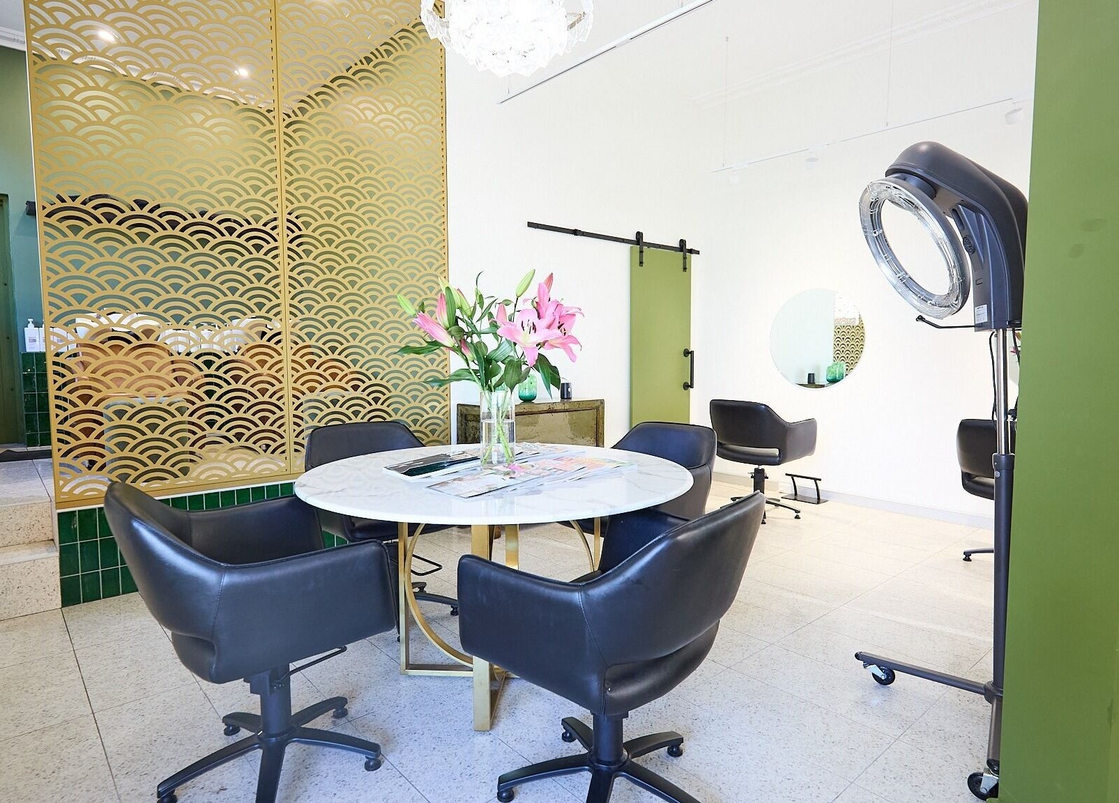 Chic interior of Lit & Scott salon in Stanmore, New South Wales, AU with modern chairs and decor.