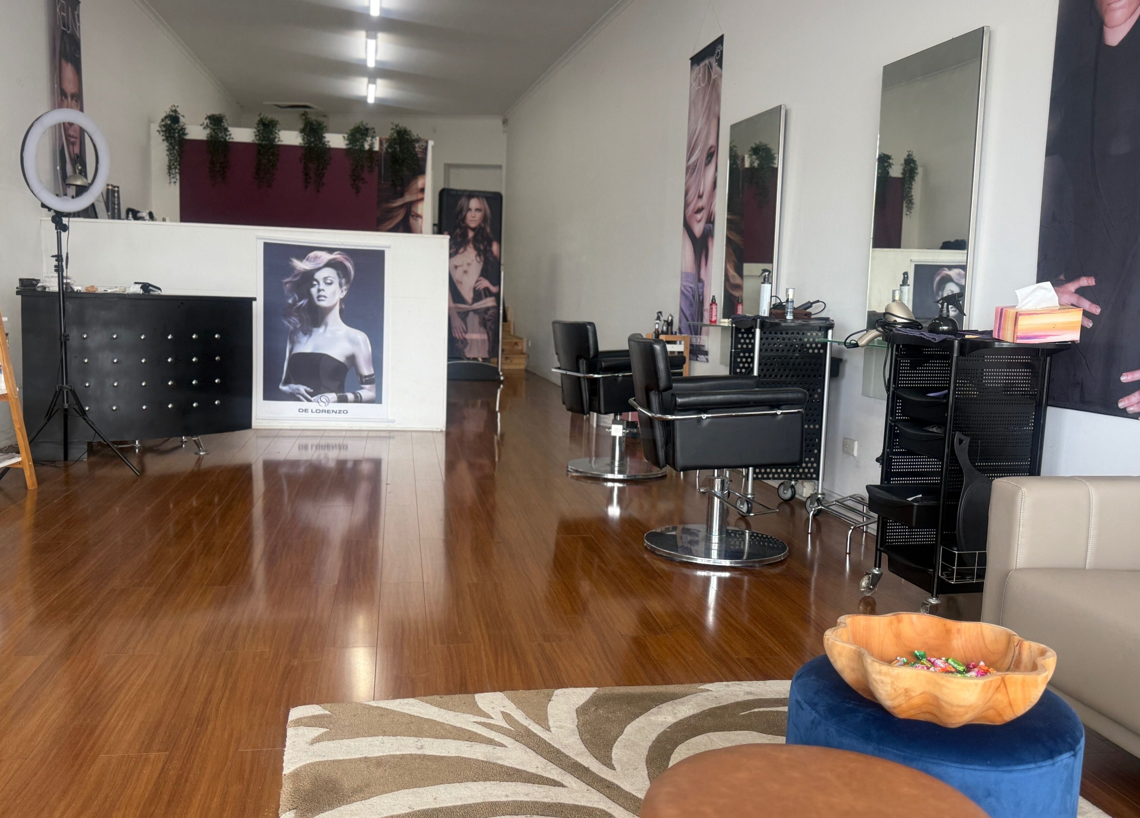 Modern Touch Hair & Beauty salon interior in Melbourne, Victoria, AU with styling stations and elegant decor.