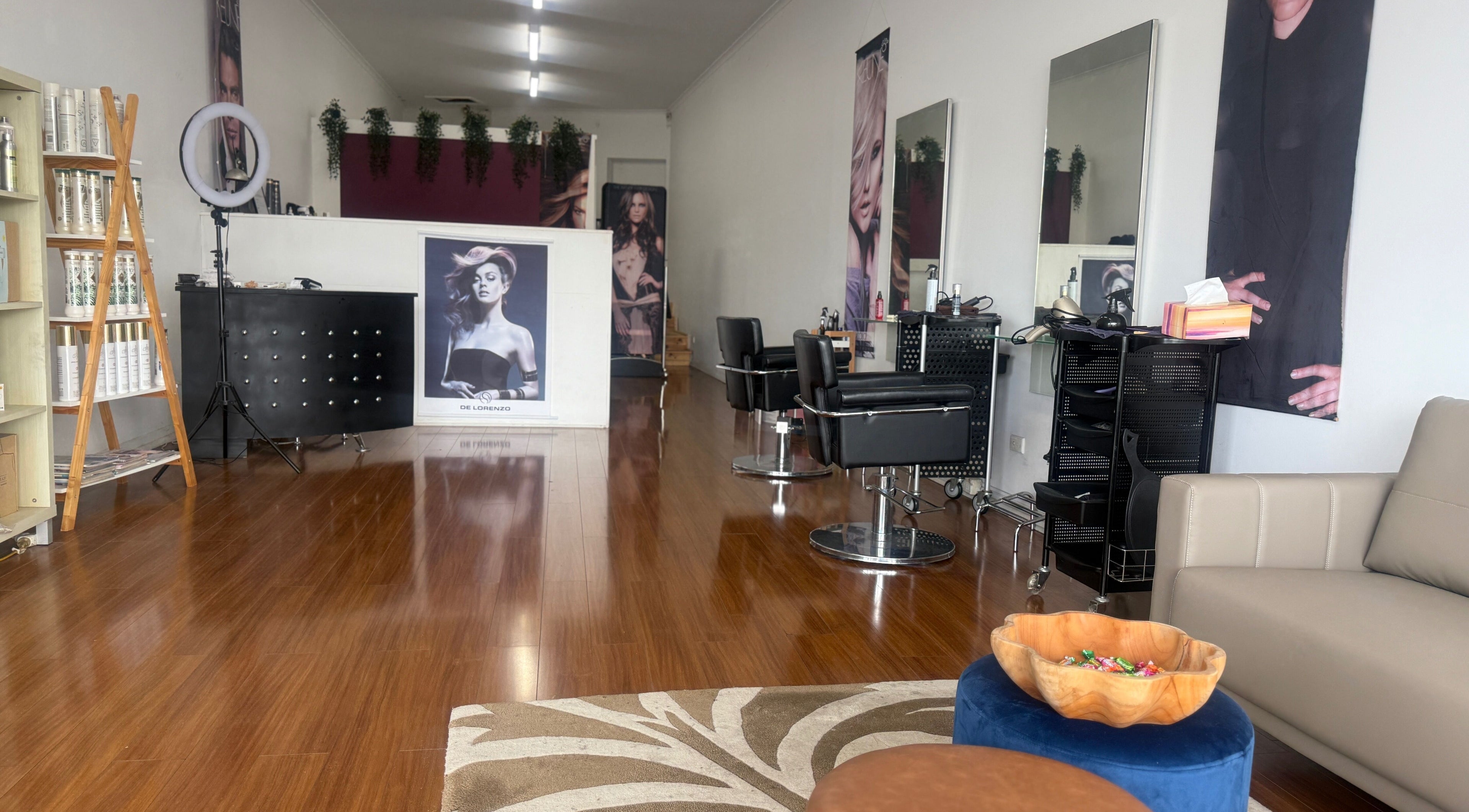 Modern Touch Hair & Beauty salon interior in Melbourne, Victoria, AU with styling stations and elegant decor.