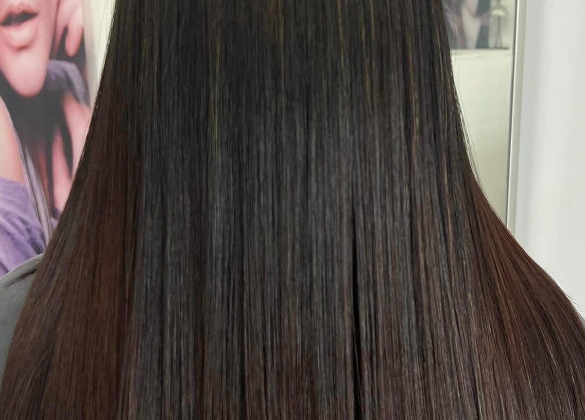 Sleek, straight hair styled at Modern Touch Hair & Beauty, Melbourne, Victoria, AU.