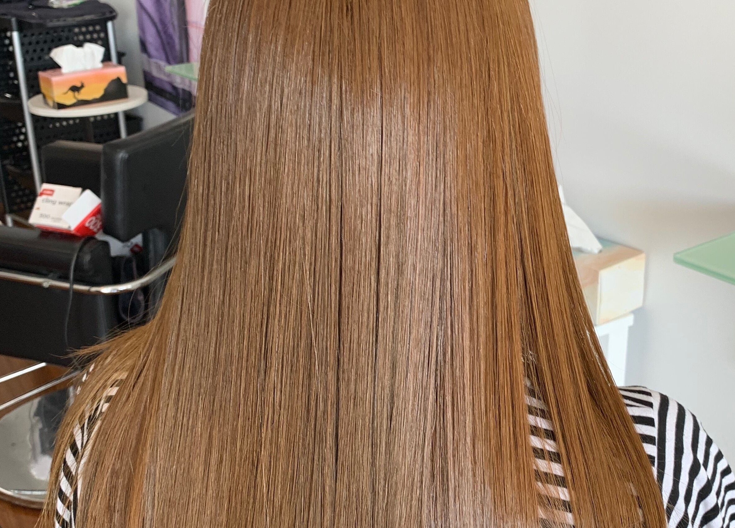 Smooth, straight hair styled at Modern Touch Hair & Beauty in Melbourne, Victoria, AU.