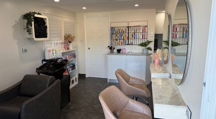 Stylish interior of Unique Hair by Lea salon in Catherine Field, New South Wales, AU showcasing modern chairs and mirrors.