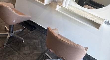 Elegant salon chairs at Unique Hair by Lea, Catherine Field, New South Wales, AU offer comfort and style.