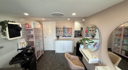 Modern salon interior at Unique Hair by Lea, Catherine Field, New South Wales, AU with stylish decor.