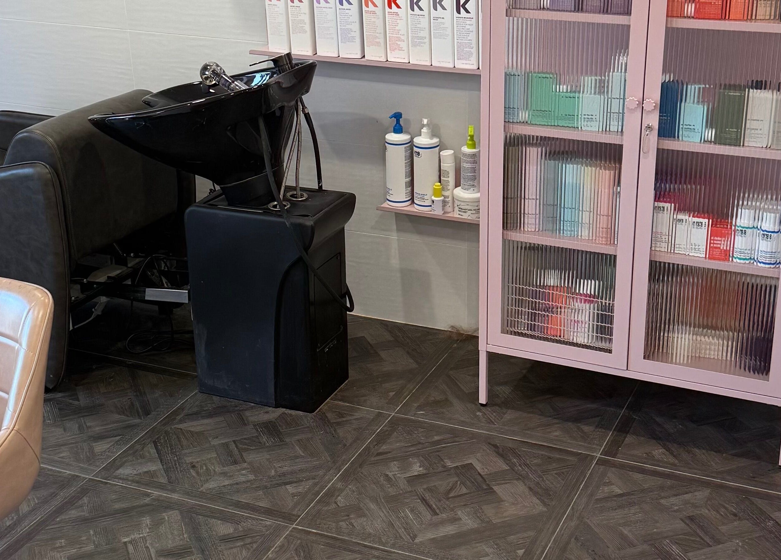 Modern salon setup at Unique Hair by Lea, Catherine Field, New South Wales, AU with chic hair wash station.