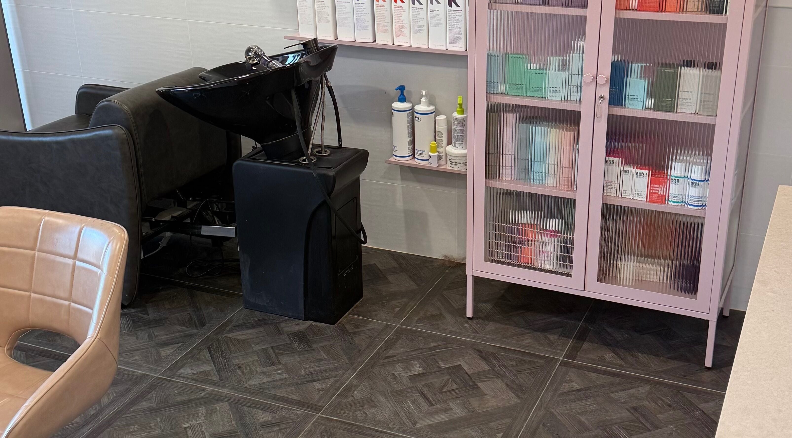 Modern salon setup at Unique Hair by Lea, Catherine Field, New South Wales, AU with chic hair wash station.