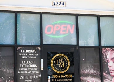 Entrance of Love Mon Beauty Spa showcasing services in Hollywood, Florida, US.