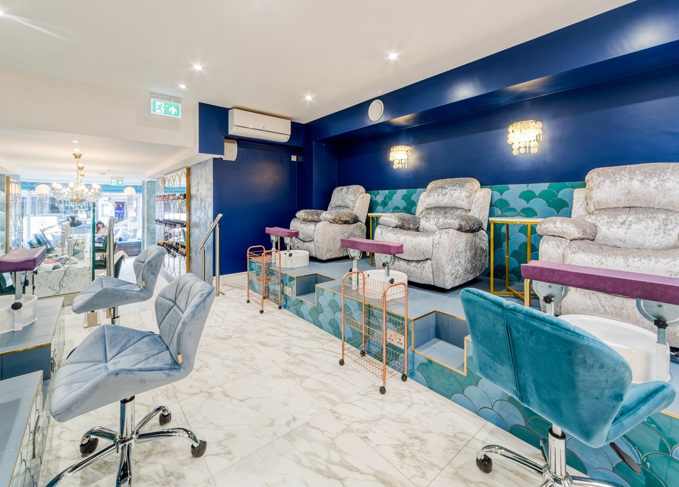 Modern pedicure area with plush seats at Medusa 622, London, England, GB, exudes opulence and comfort.