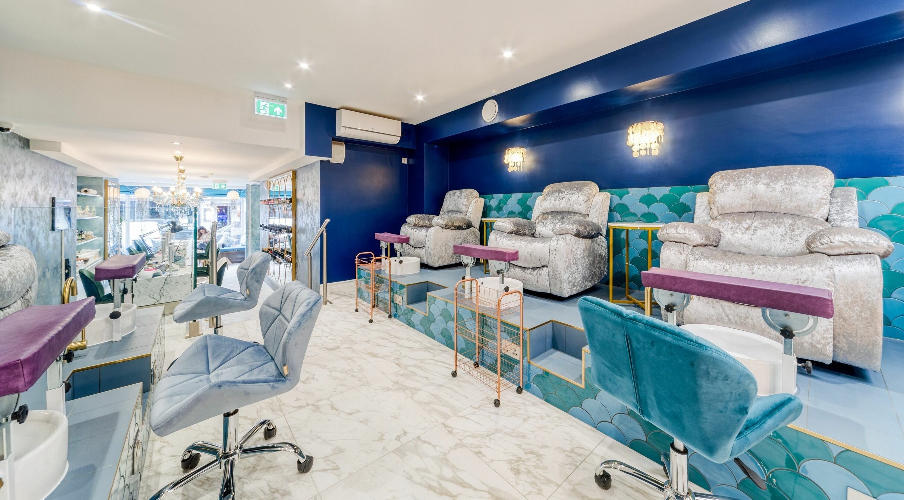 Modern pedicure area with plush seats at Medusa 622, London, England, GB, exudes opulence and comfort.