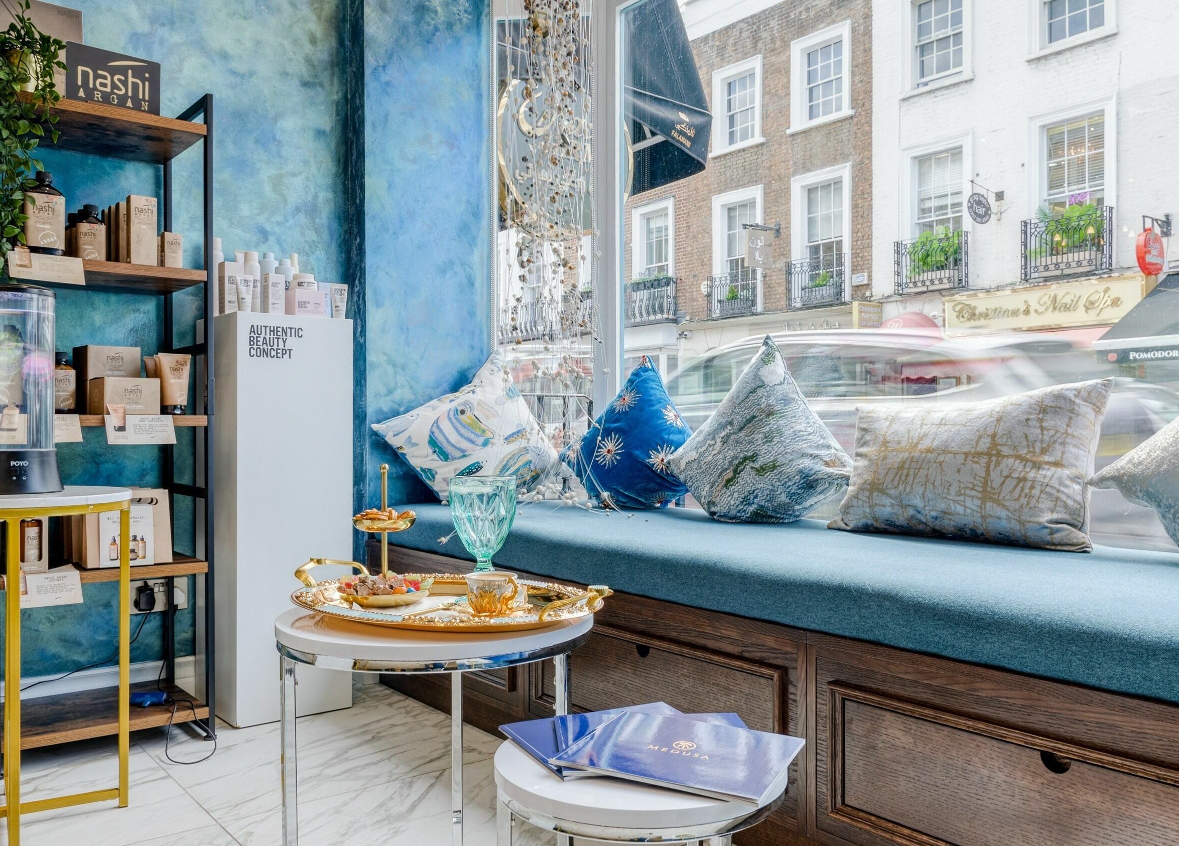 Cozy seating and beauty products at Medusa 622, London, England, GB, showcasing elegance and comfort.