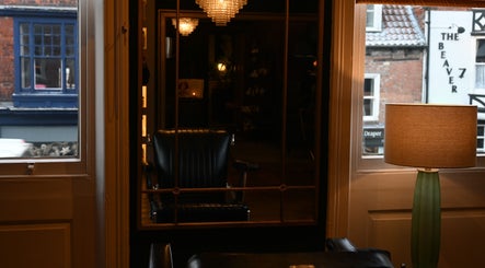 Elegant interior view at Regents of Beverley, Beverley, England, GB displaying a classic chair and lamp.