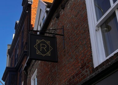 Signage of Regents of Beverley on a brick facade in Beverley, England, GB.