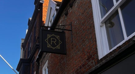 Signage of Regents of Beverley on a brick facade in Beverley, England, GB.