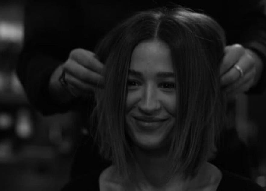 Smiling woman getting hairstyle at Regents of Beverley salon, Beverley, England, GB