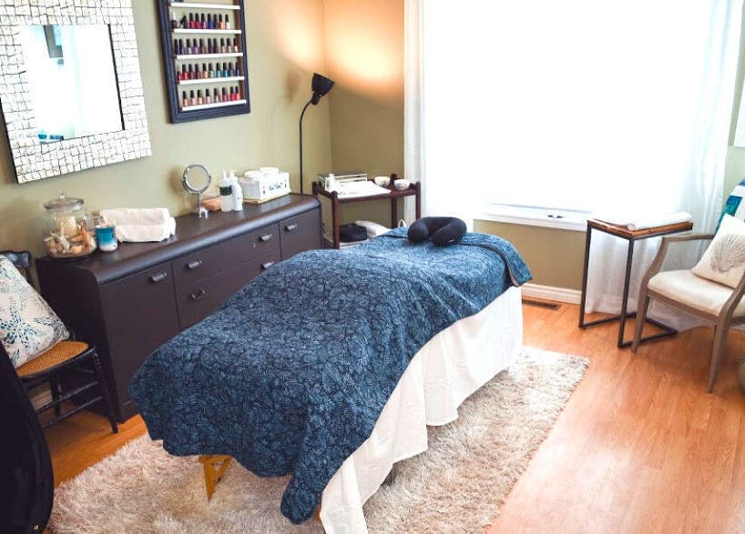 Tranquil massage room at Bronzed Beauty Bar, Lucan, Ontario, CA, featuring a cozy treatment table.