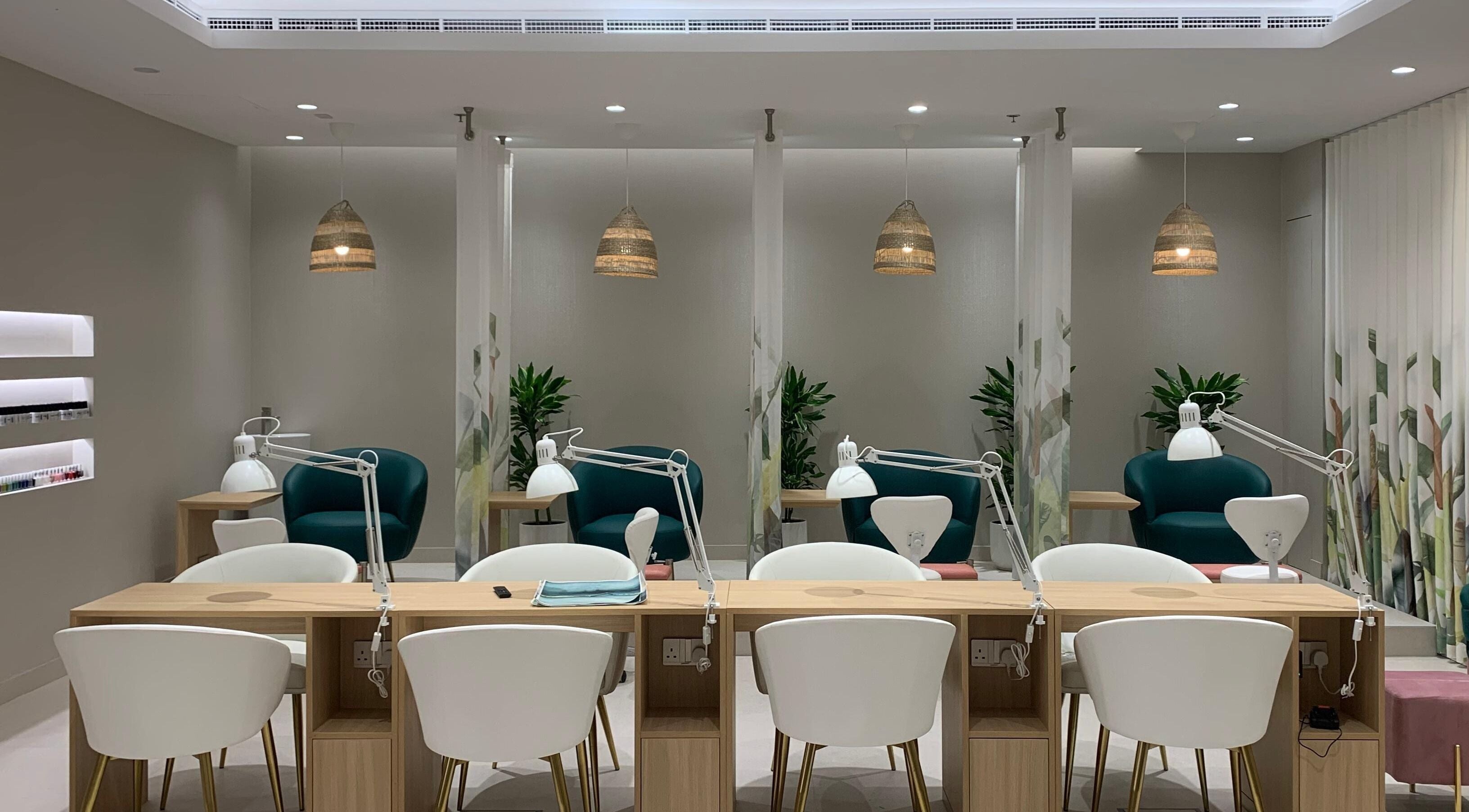 Elegant nail station at Kohibaa Beauty Salon The Greens, Dubai, Dubai, AE with modern decor and cozy seating.