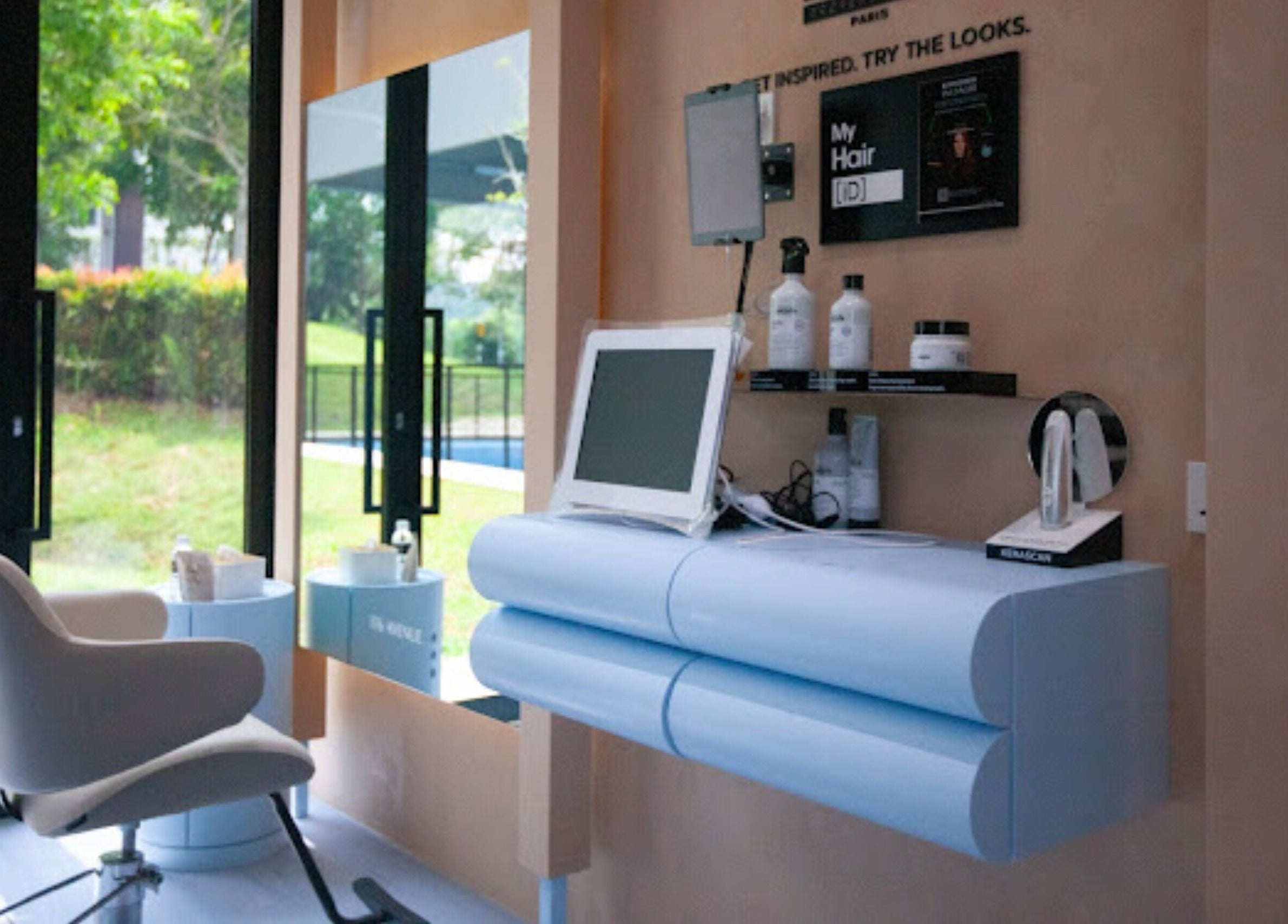 Stylish salon interior at 176 Avenue at KLGCC, Kuala Lumpur, featuring modern design and lush views.