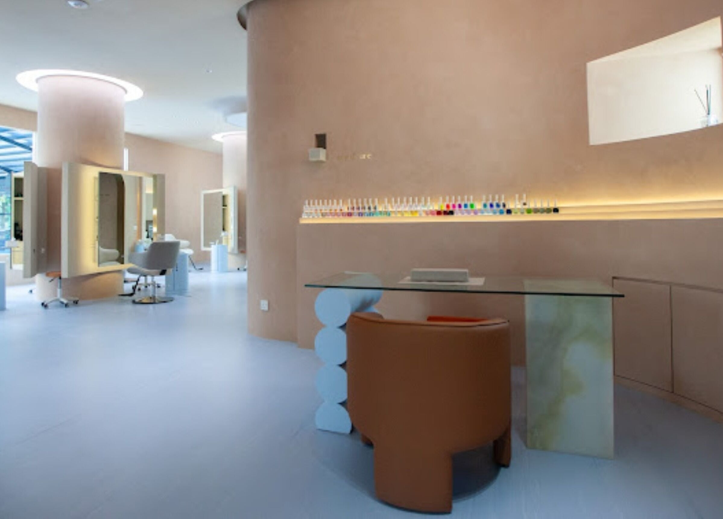 Modern beauty salon interior at 176 Avenue at KLGCC, Kuala Lumpur, featuring sleek design and nail polish display.