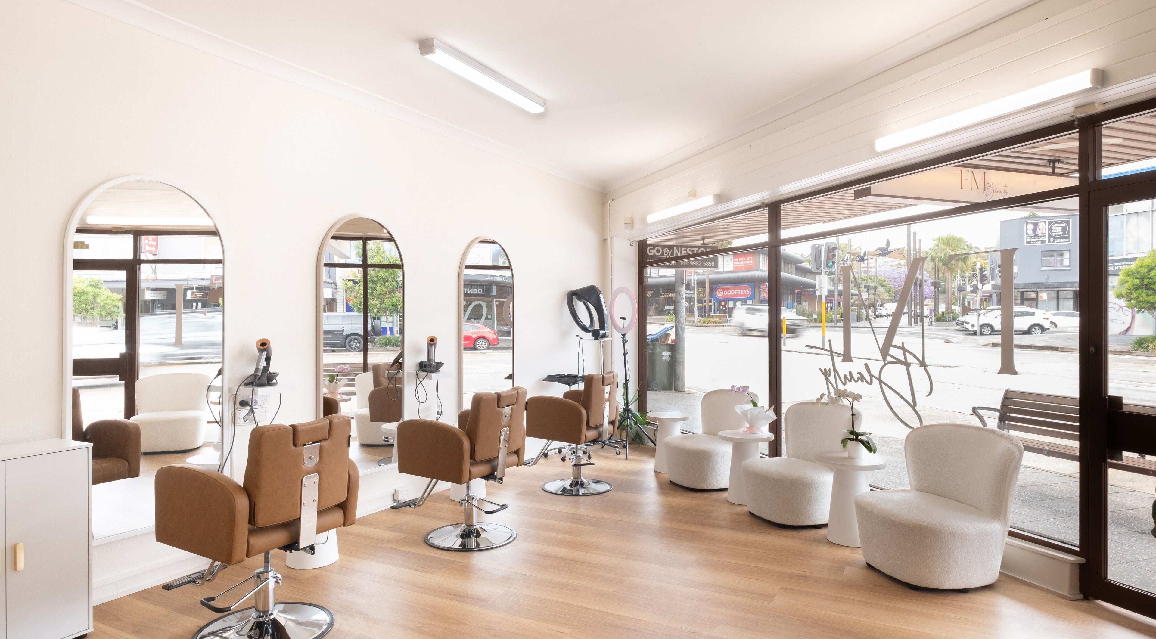 Modern salon interior at FM Beauty Clinic, Dee Why, New South Wales, AU with stylish seating and mirrors.