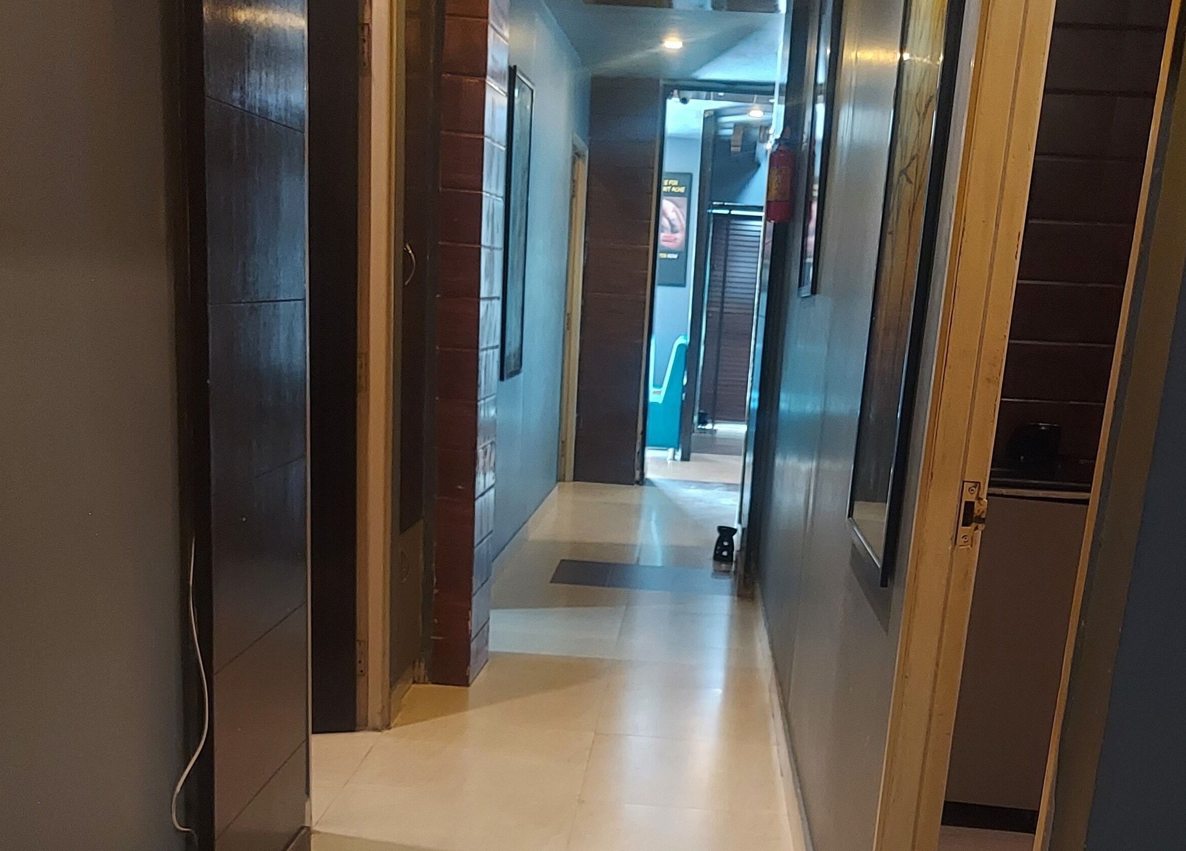 Inviting hallway at Blue Tree Spa in Ghaziabad, Uttar Pradesh, IN, leading to tranquil treatment rooms.