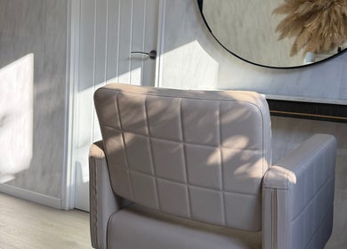 Sophisticated salon chair at Victorium Hair and Extensions in Exmouth, England, GB with modern decor.
