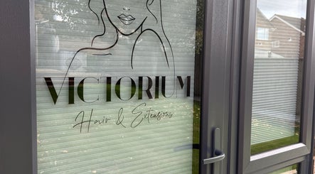 Victorium Hair and Extensions entrance door with logo in Exmouth, England, GB.