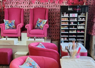 Vibrant nail salon seating at Ginasty Nails&Beauty Studio, Cape Town, Western Cape, ZA with pink decor.