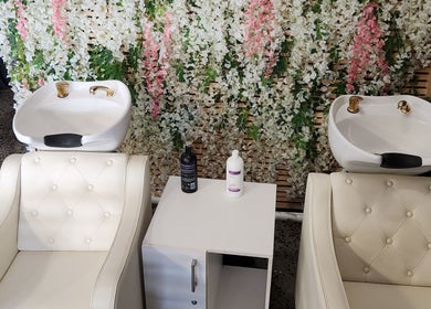 Luxurious wash stations at Ginasty Nails & Beauty Studio, Cape Town, Western Cape, ZA, adorned with floral decor.