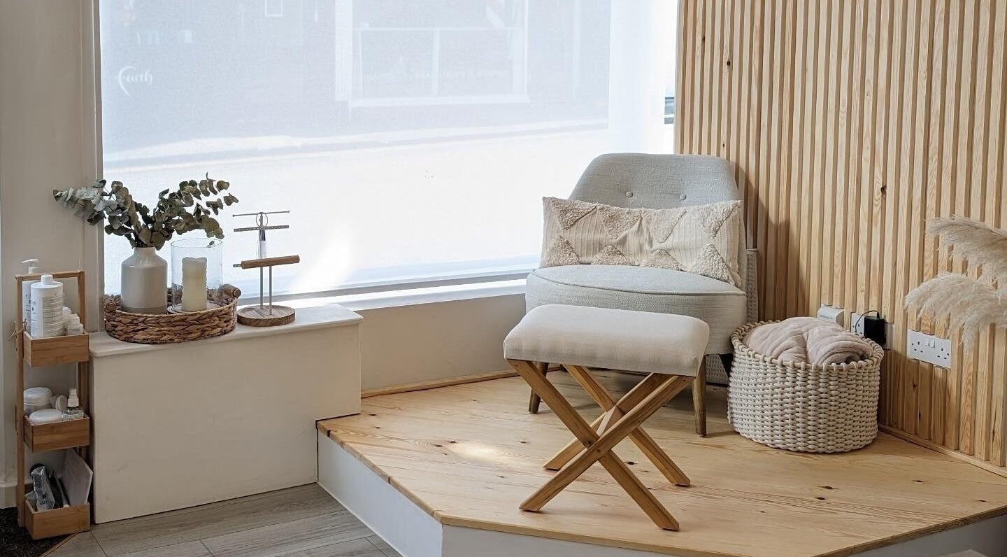 Cozy corner at Amber Lees, Conwy, Wales, GB featuring a plush chair beside a large window.