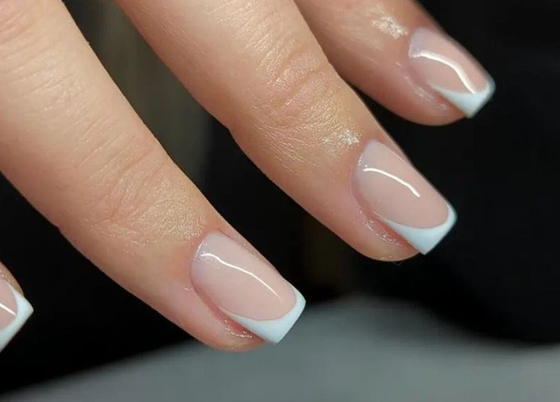 French manicure at Amber Lees in Conwy, Wales, GB - polished nails with white tips.