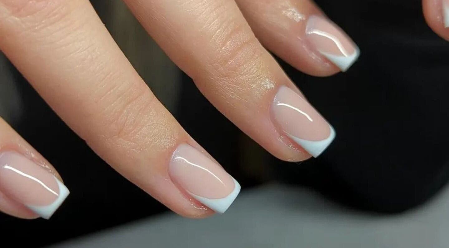 French manicure at Amber Lees in Conwy, Wales, GB - polished nails with white tips.