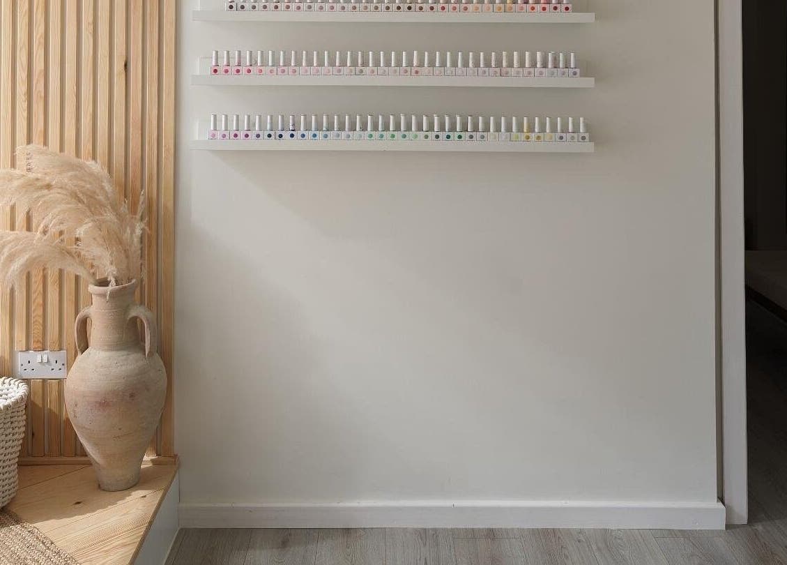 Elegant nail polish display at Amber Lees, Conwy, Wales, GB showcasing minimalist decor and serene ambiance.