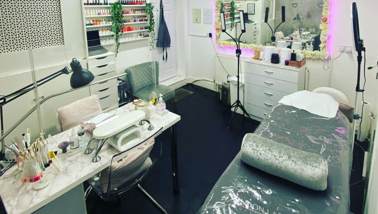 Elyshia at E Beautique salon interior featuring manicure and treatment areas in Shenfield, England, GB.
