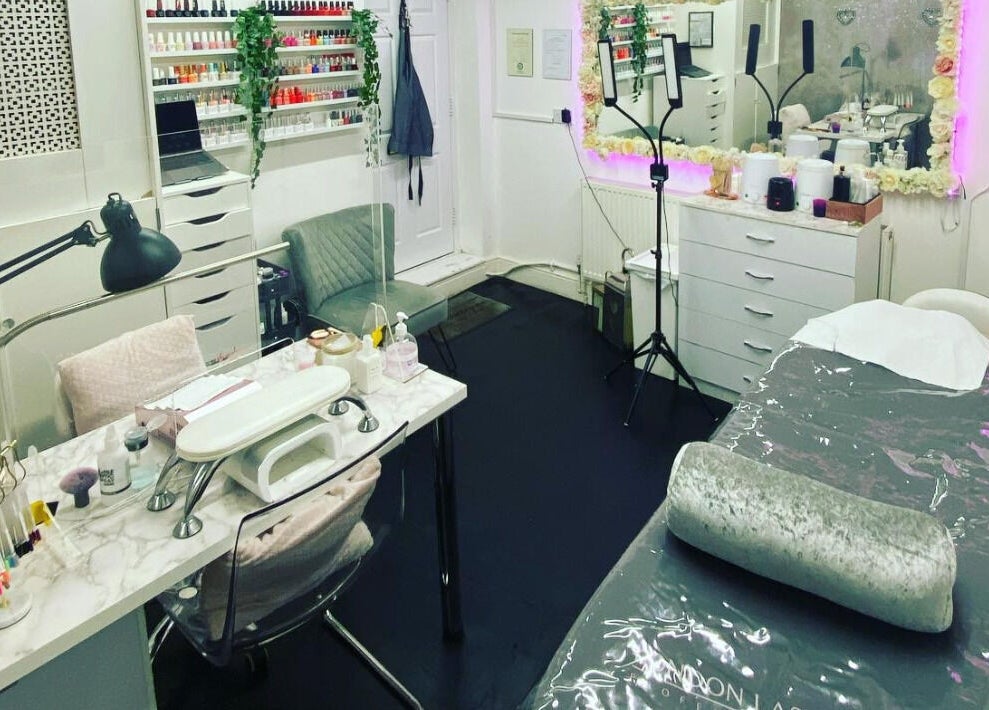 Elyshia at E Beautique salon interior featuring manicure and treatment areas in Shenfield, England, GB.