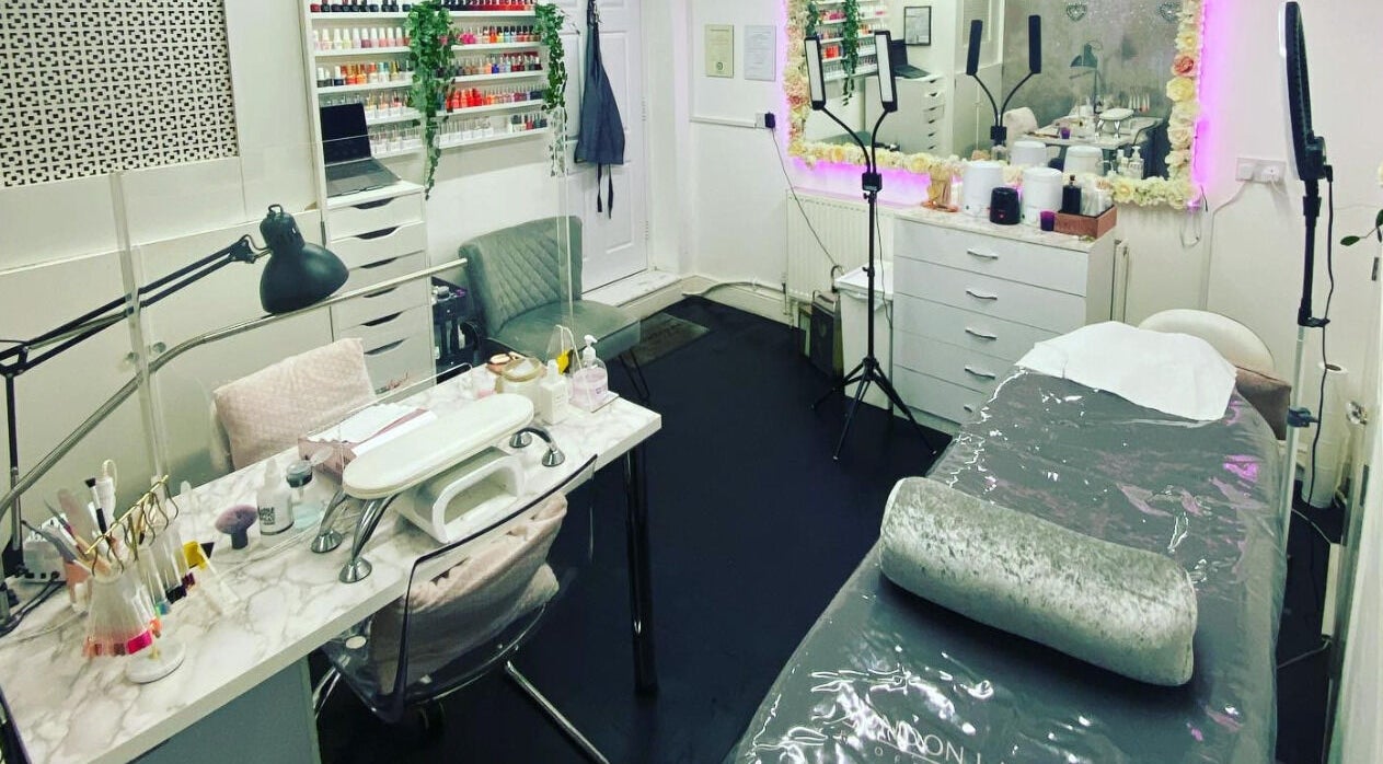 Elyshia at E Beautique salon interior featuring manicure and treatment areas in Shenfield, England, GB.