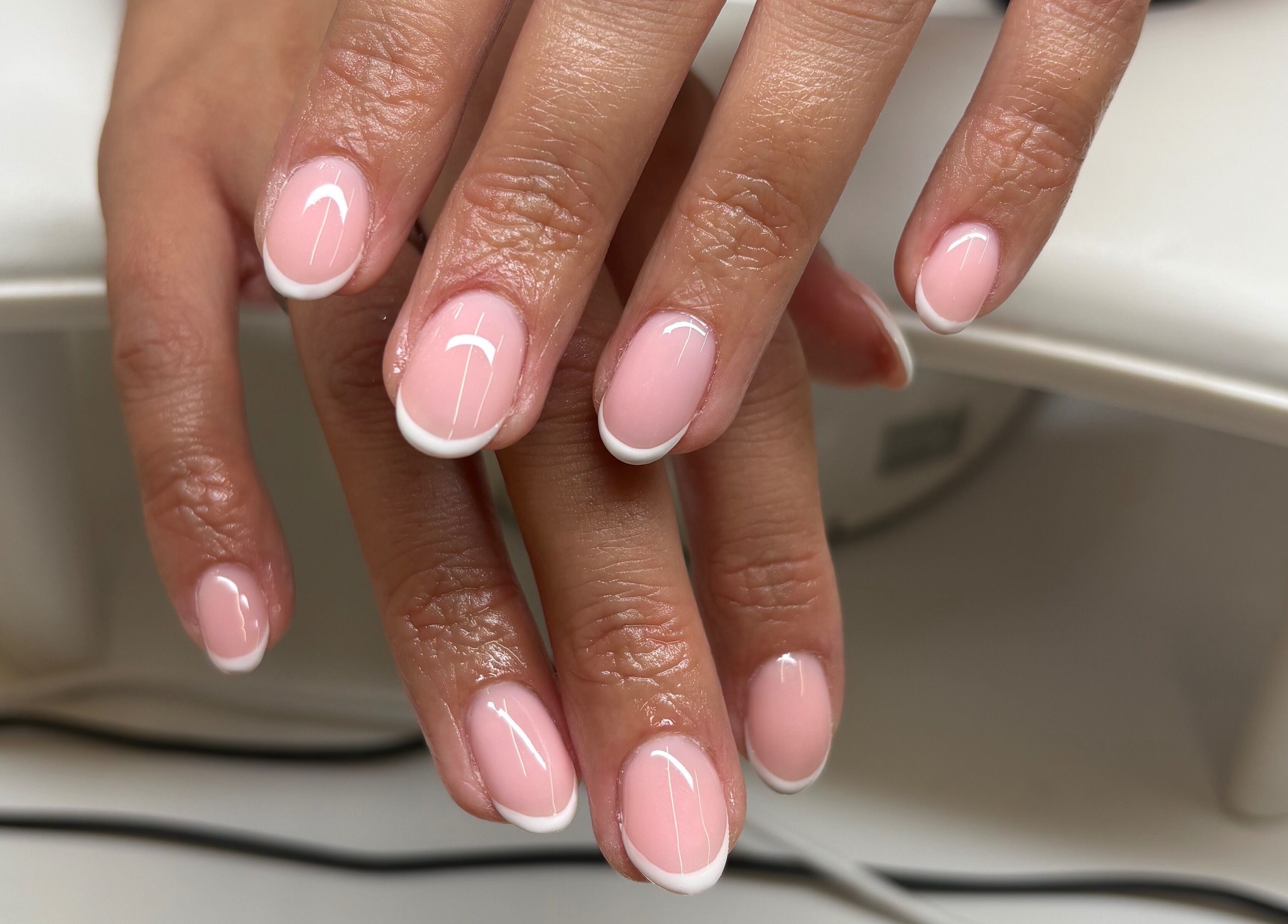 Elegant French manicure by Elyshia at E Beautique, Shenfield, England, GB. Perfect nails for a refined look.