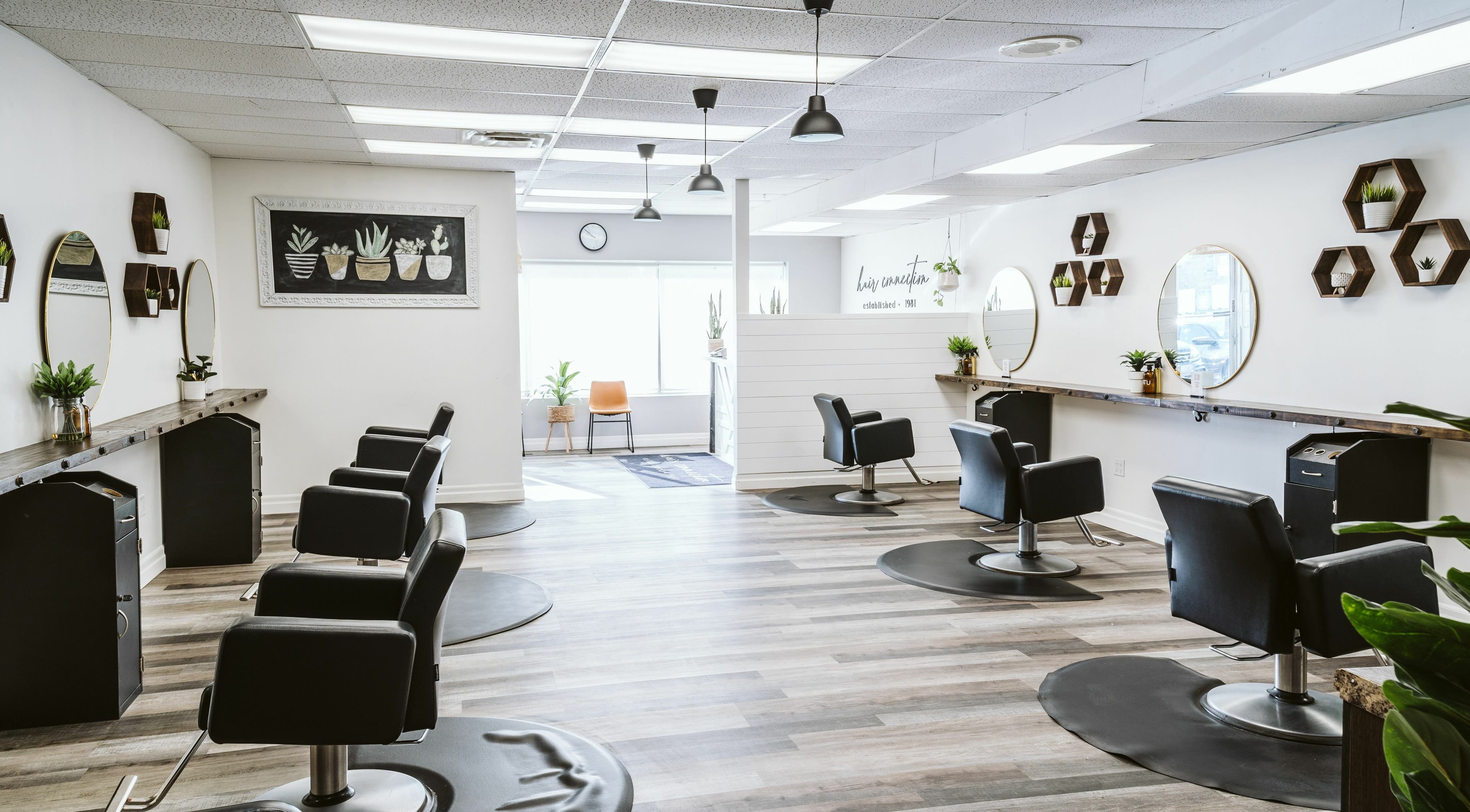 Modern interior of Hair Connection Kincardine, Kincardine, Ontario, CA with stylish salon chairs and decor.