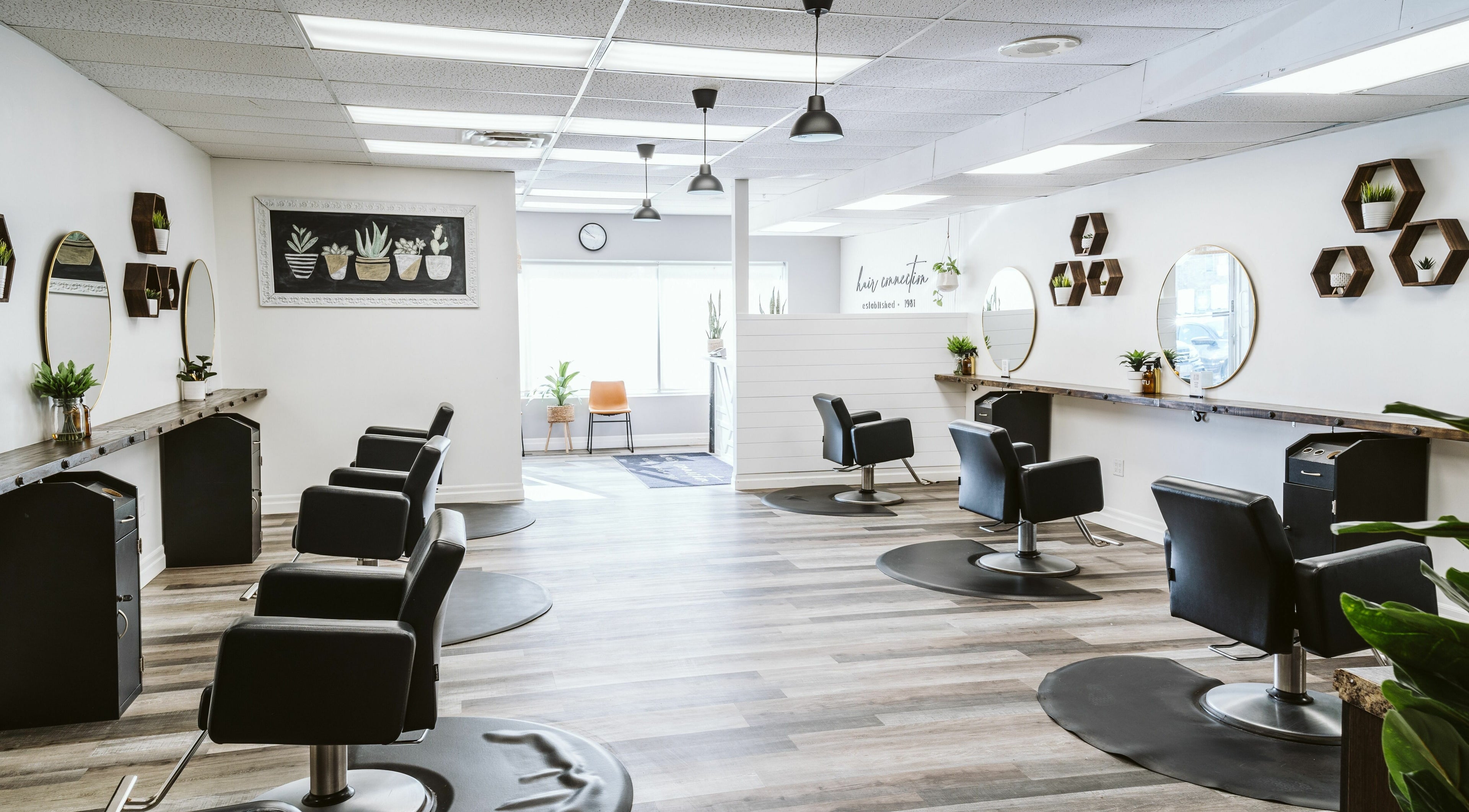 Modern interior of Hair Connection Kincardine, Kincardine, Ontario, CA with stylish salon chairs and decor.