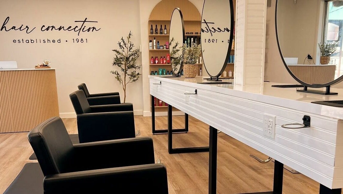 Elegant interior of Hair Connection Port Elgin in Port Elgin, Ontario, CA, featuring modern salon chairs and mirrors.