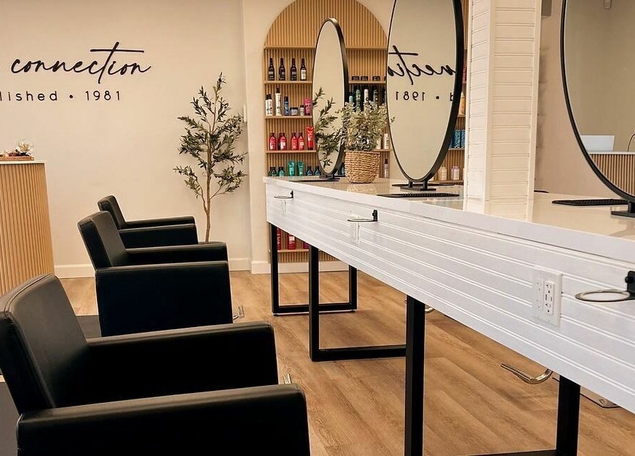 Elegant interior of Hair Connection Port Elgin in Port Elgin, Ontario, CA, featuring modern salon chairs and mirrors.