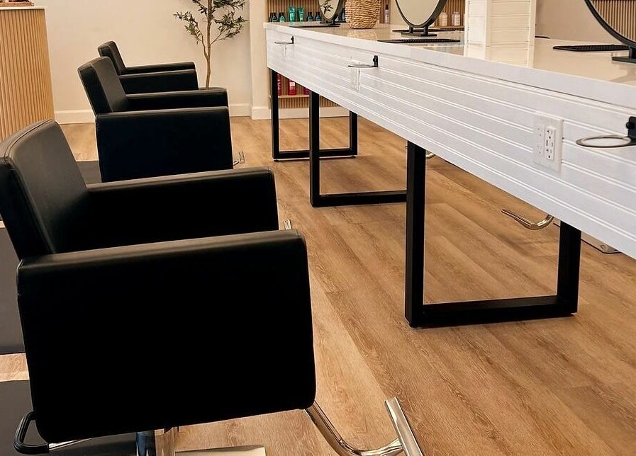 Modern salon seating at Hair Connection Port Elgin, Port Elgin, Ontario, CA with sleek chairs and workstations.