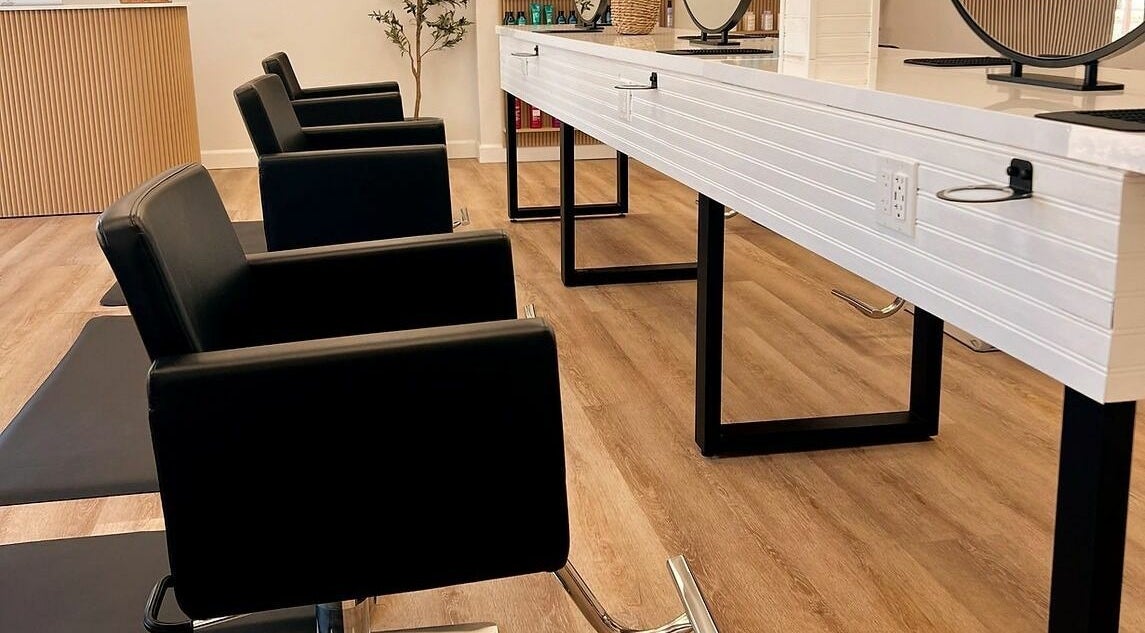 Modern salon seating at Hair Connection Port Elgin, Port Elgin, Ontario, CA with sleek chairs and workstations.