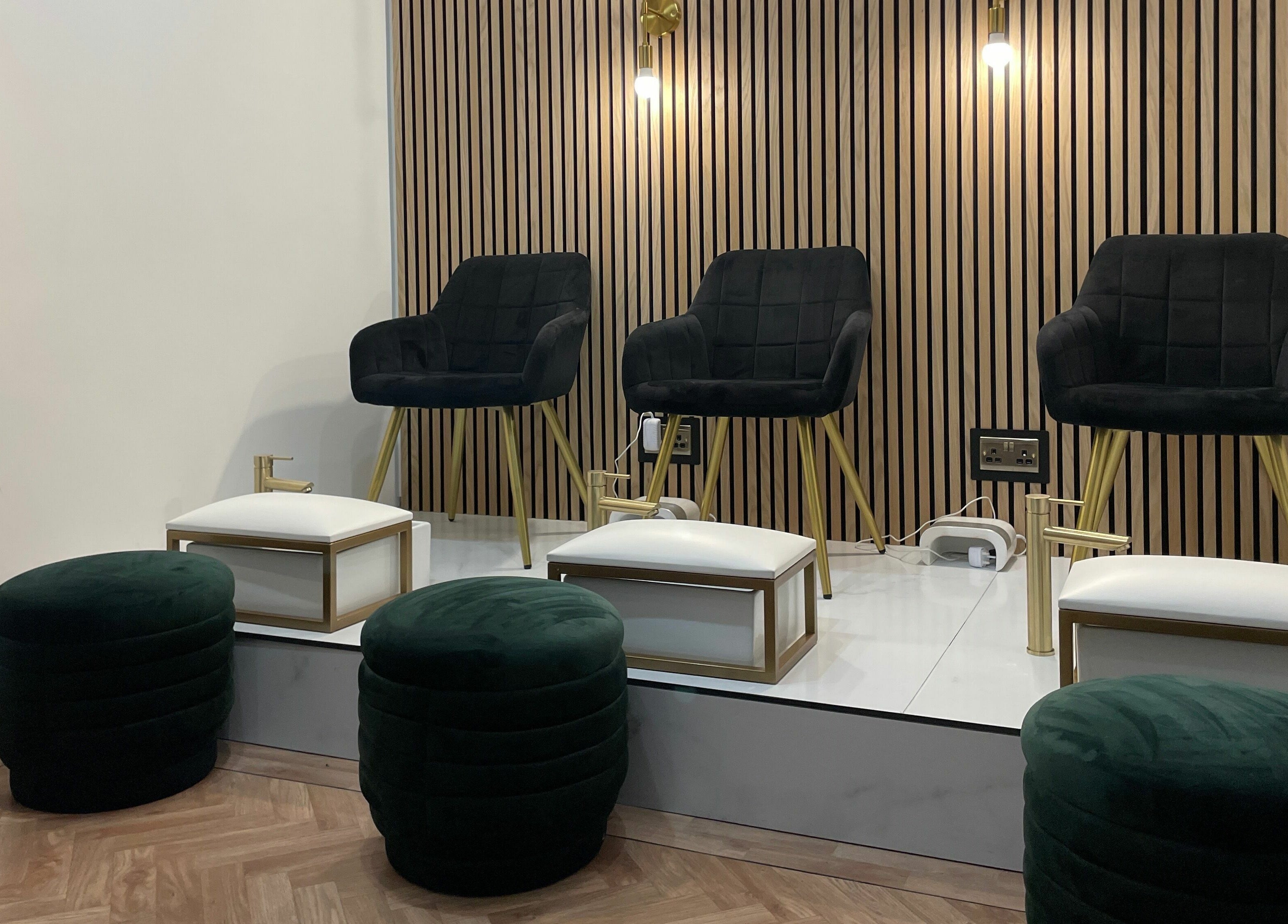 Elegant seating area at À La Mode, Colchester, England, GB, featuring plush chairs and modern decor.