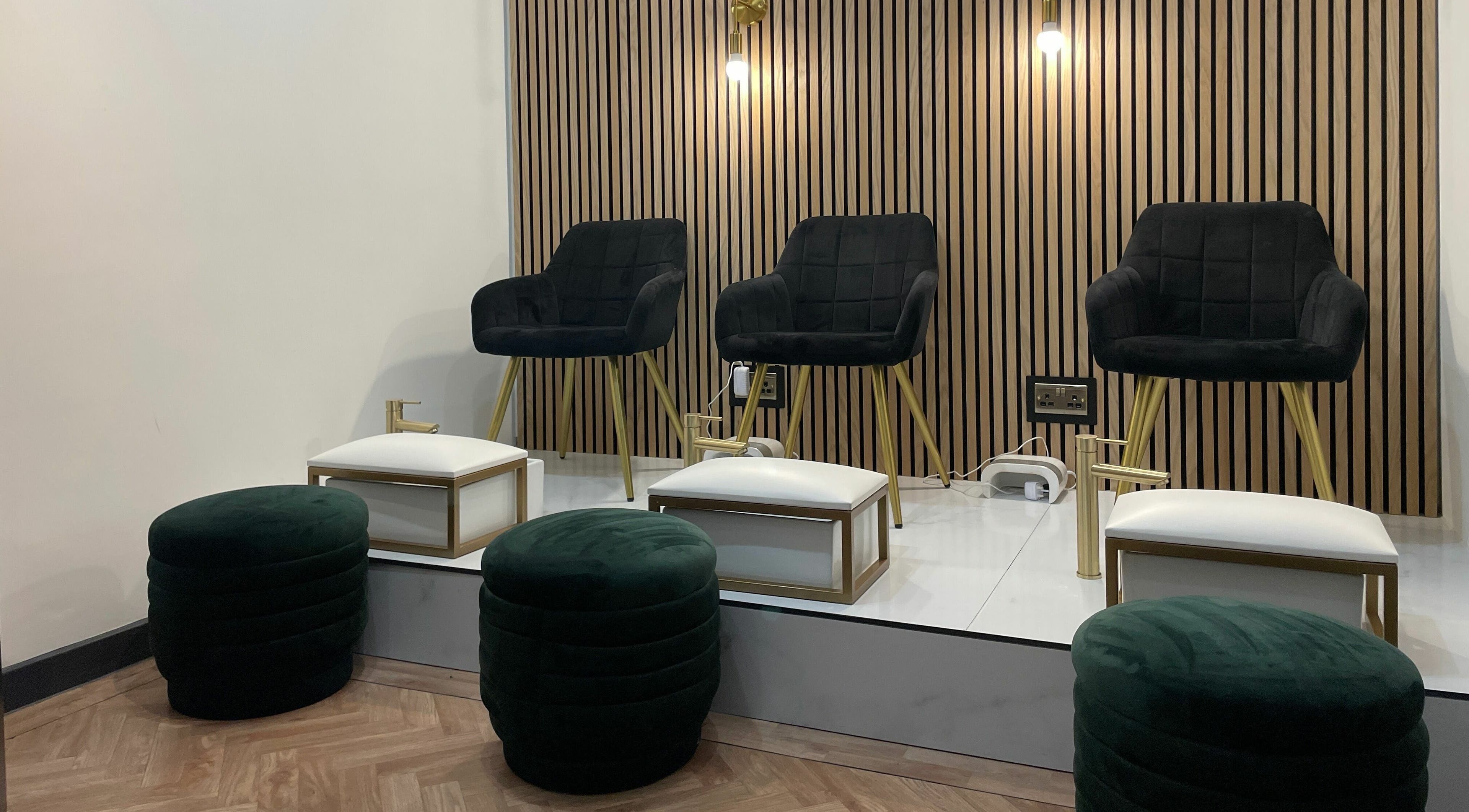 Elegant seating area at À La Mode, Colchester, England, GB, featuring plush chairs and modern decor.