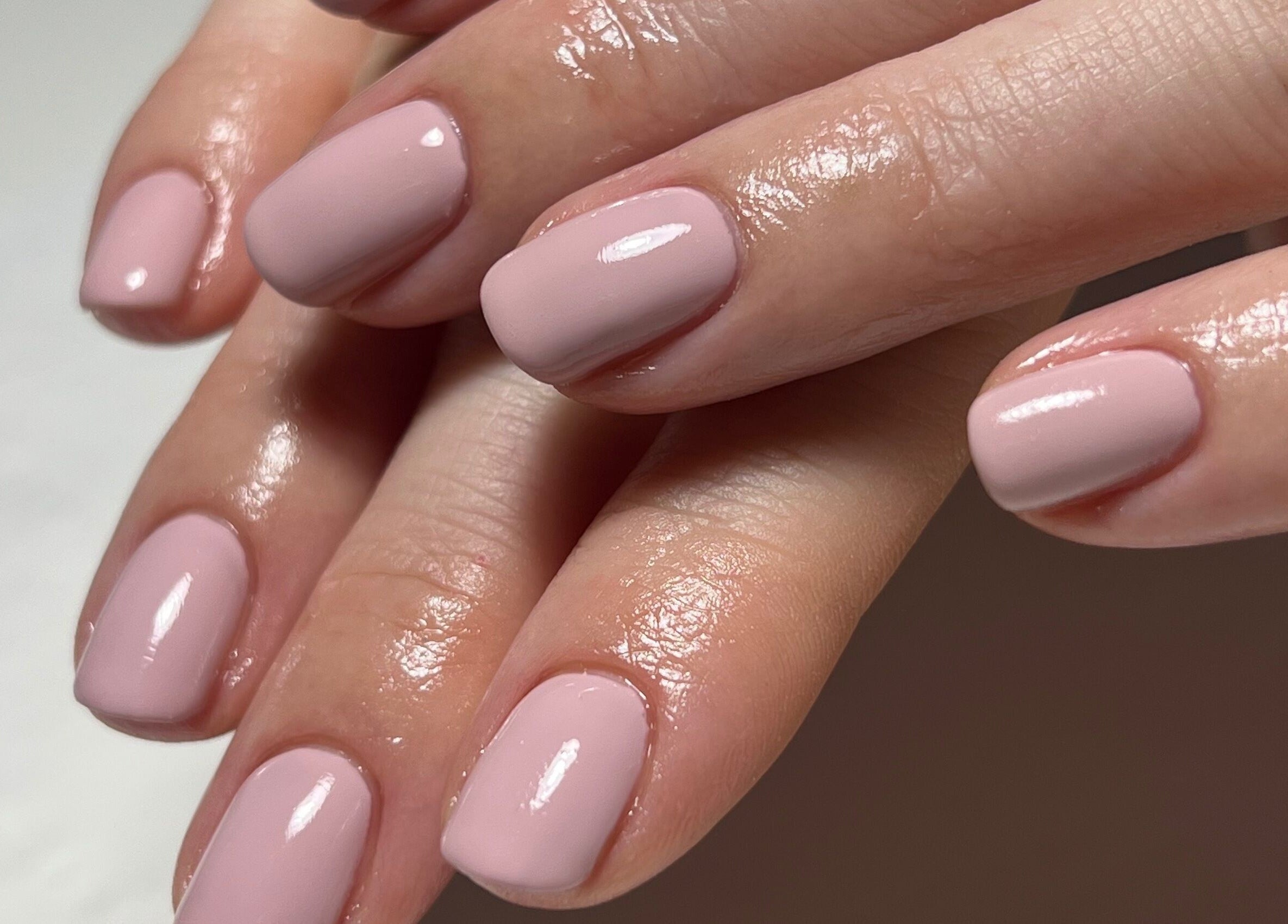Glossy manicured nails at By Bethany Rose, Hatfield, England, GB. Perfect for a polished look.
