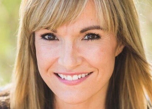 Smiling person at Natural Reflections Spa, Elizabeth, Colorado, US, enjoying the serene wellness experience.