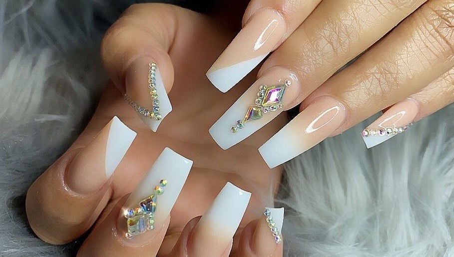 Elegant nail art with crystals at MiLinda519, Savannah, Georgia, US, showcasing intricate designs.